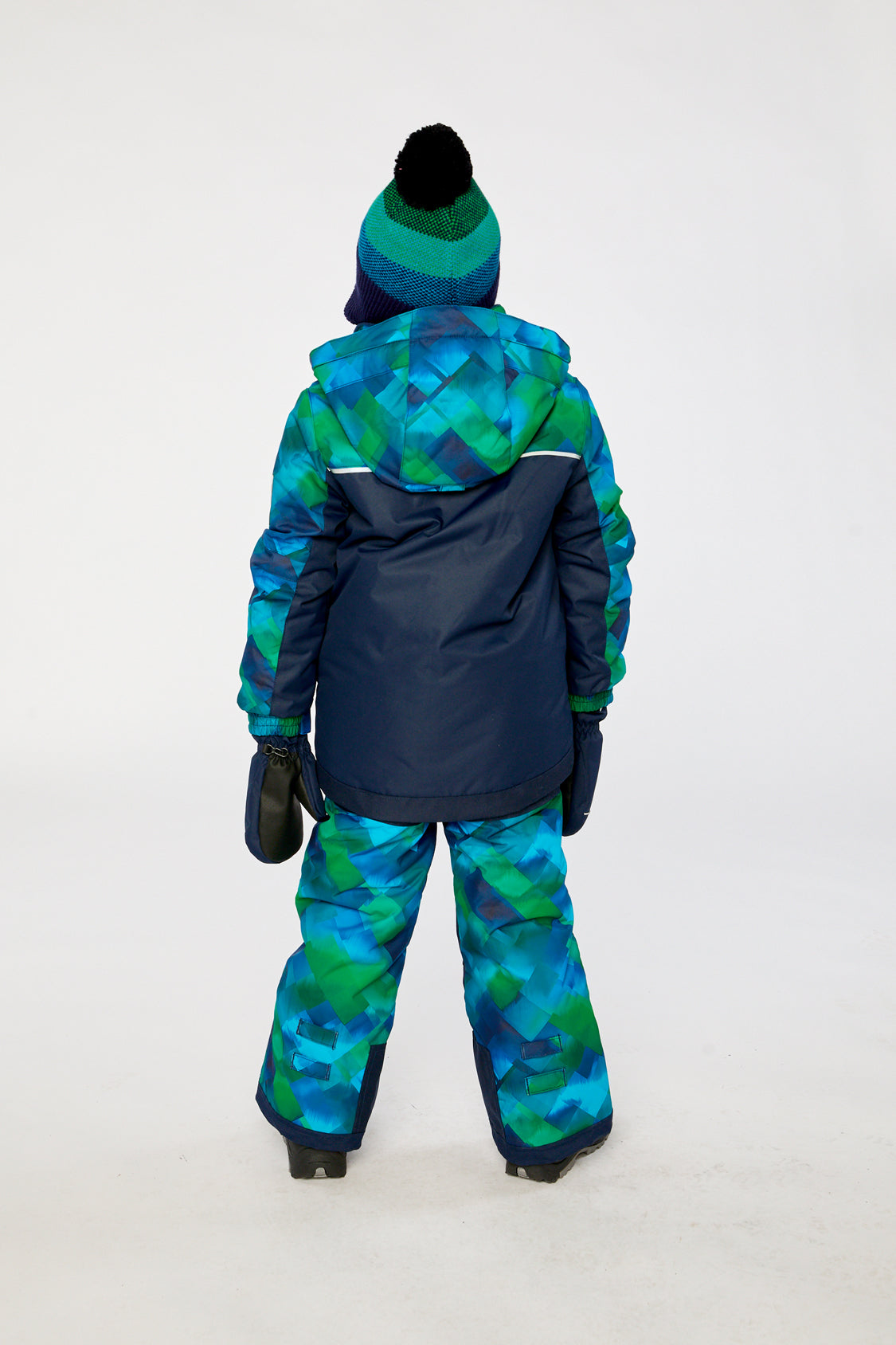 Child wearing the Deux par Deux blue and green checkered PLAY snowsuit, back view