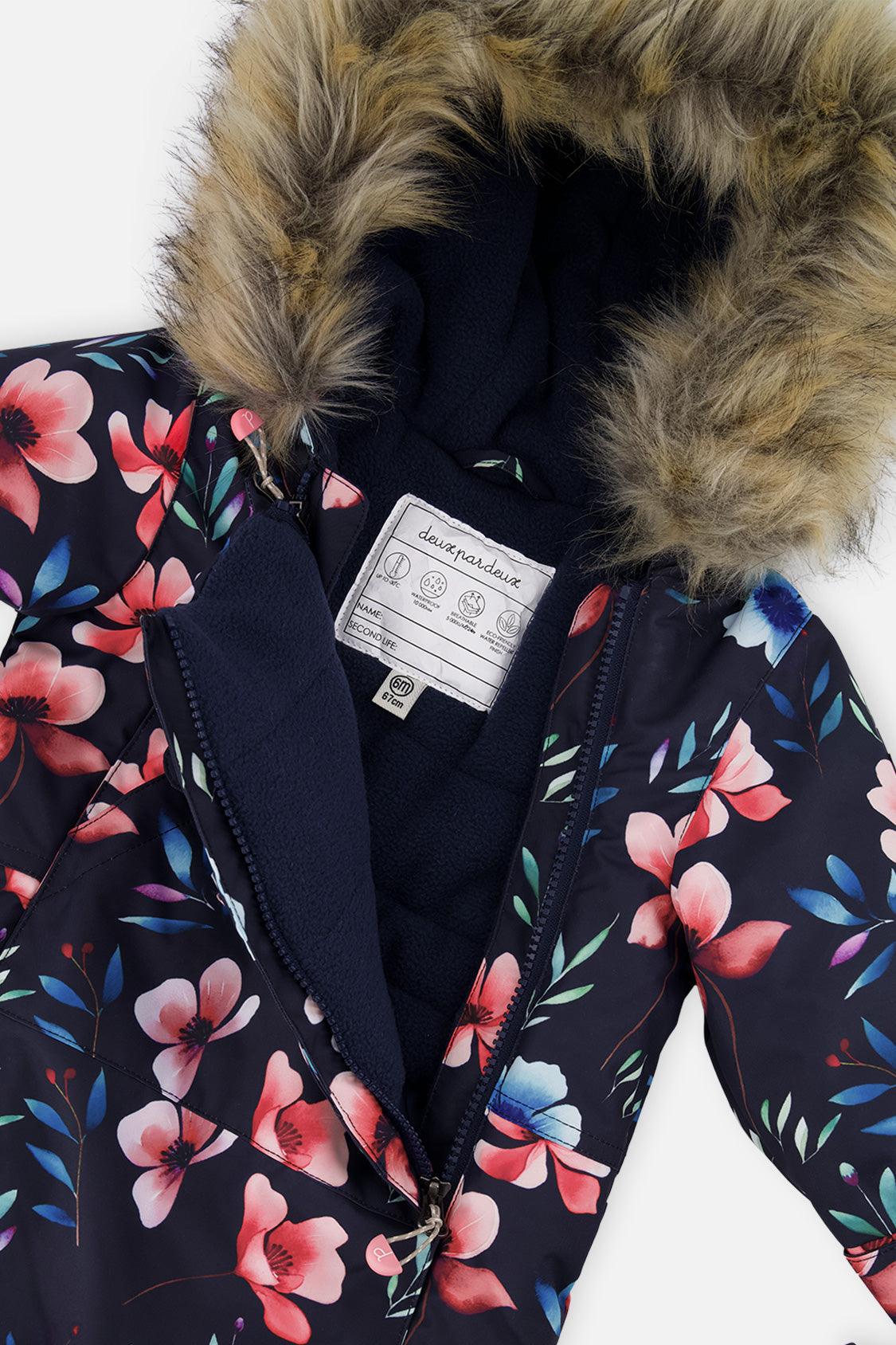 Close-up of the faux-fur trimmed hood and fleece-lined chest of the navy blue floral print snowsuit