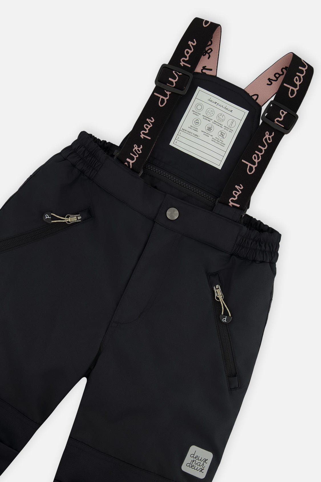 Deux par Deux girls PLAY snowsuit, black with leopard faux fur – close-up of the suspenders and zippered pant pockets