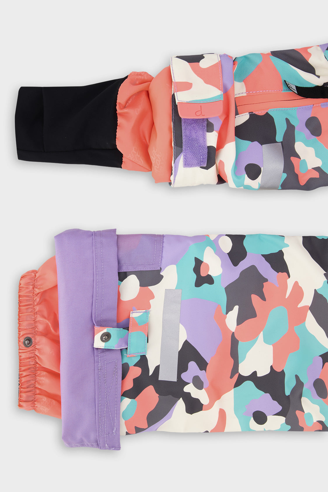 Deux par Deux girls' Teknik two-piece snowsuit in coral camouflage print with lilac panels – sleeve cuff and pant hem details