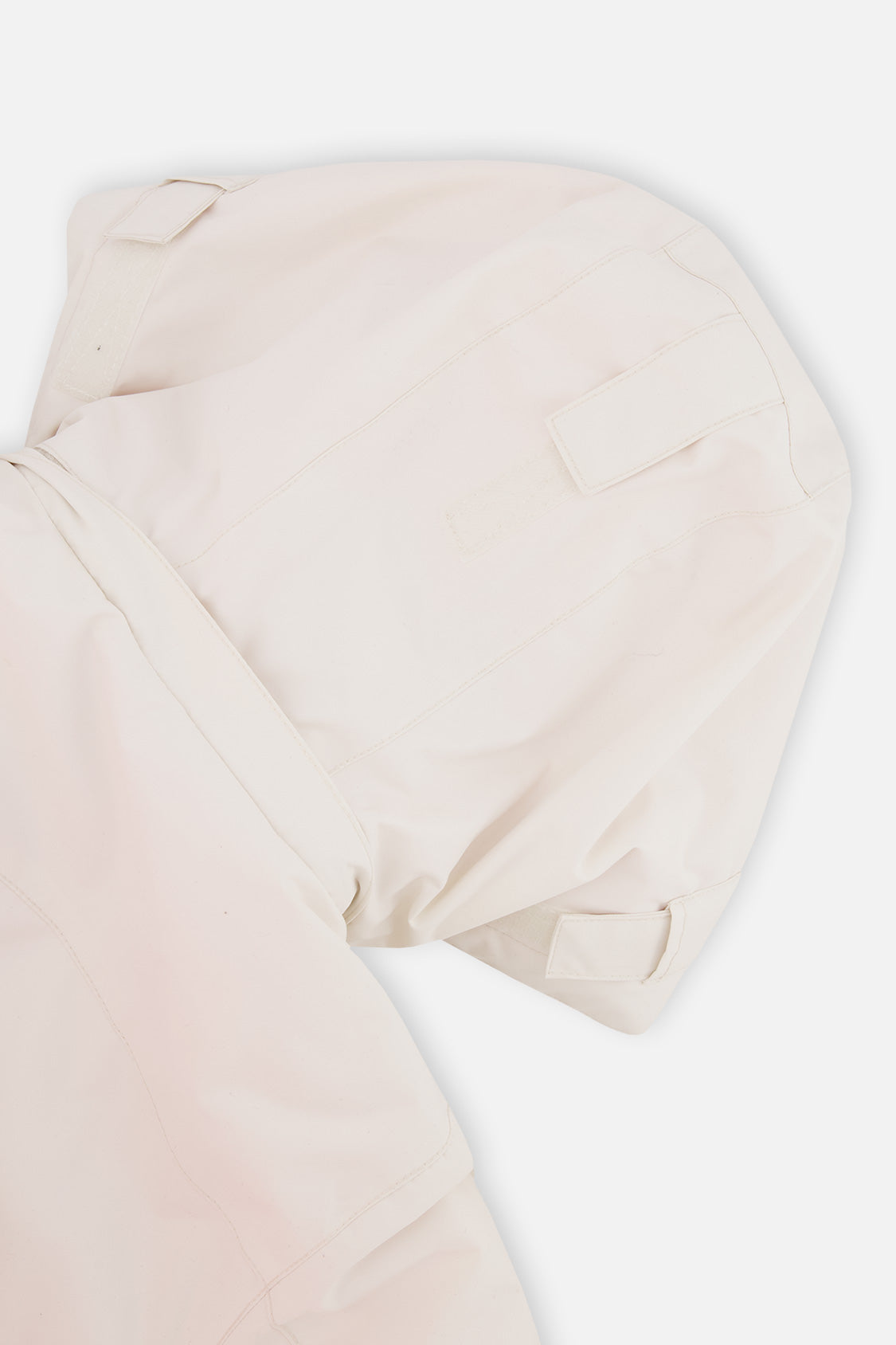 Close-up of the off-white and pink TEKNIK jacket hood