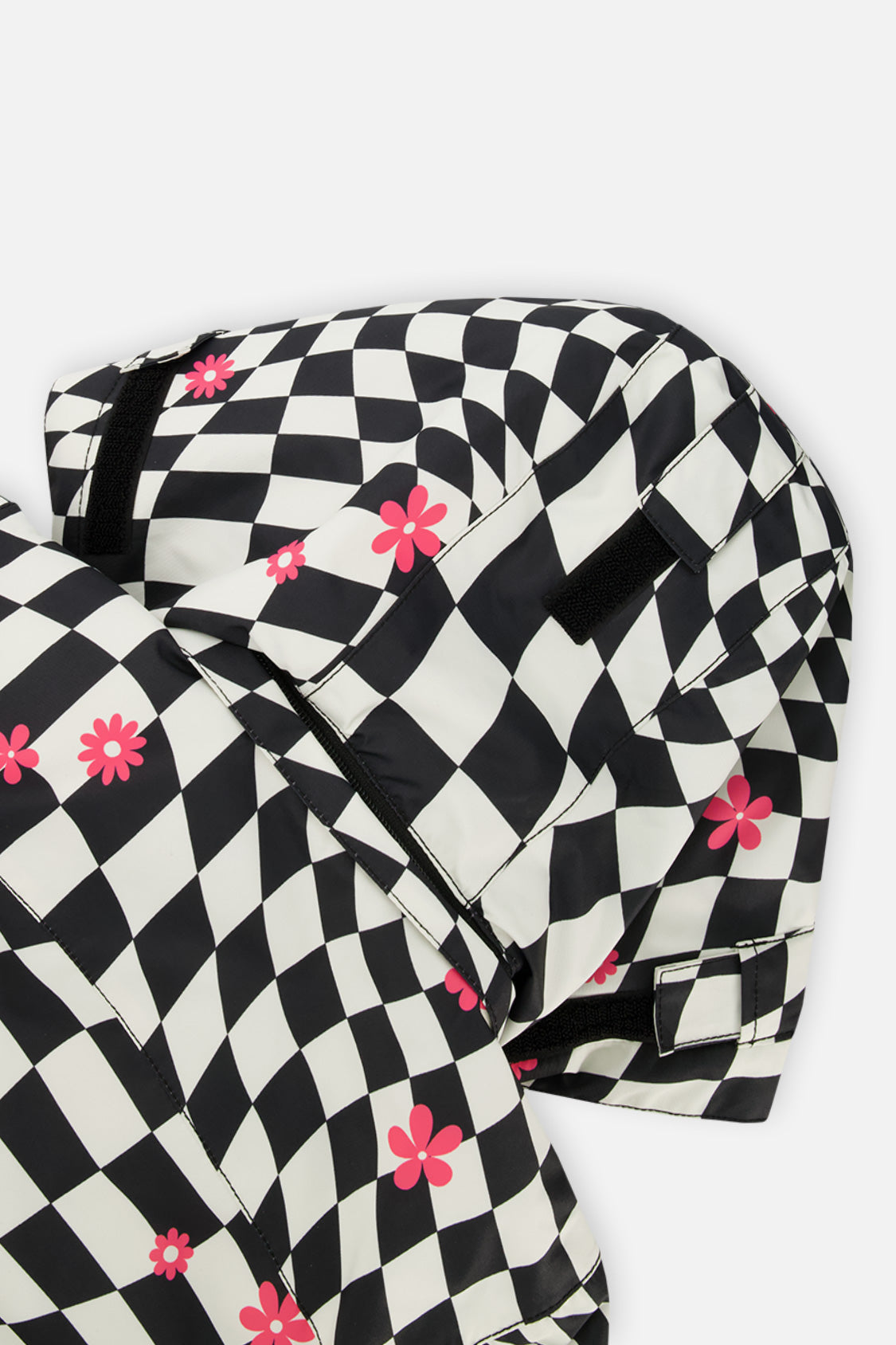Close-up of the checkered TEKNIK hood with small pink flowers