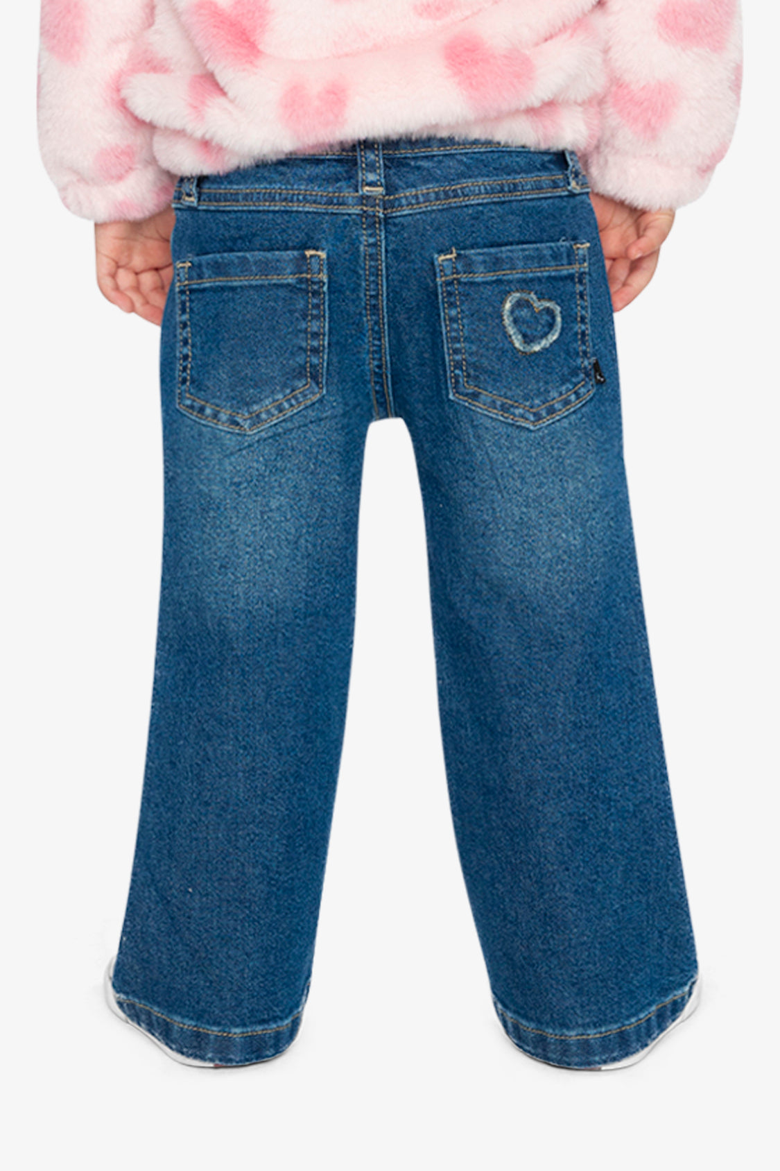 Child wearing the navy boot leg jeans, back view with a heart on one back pocket