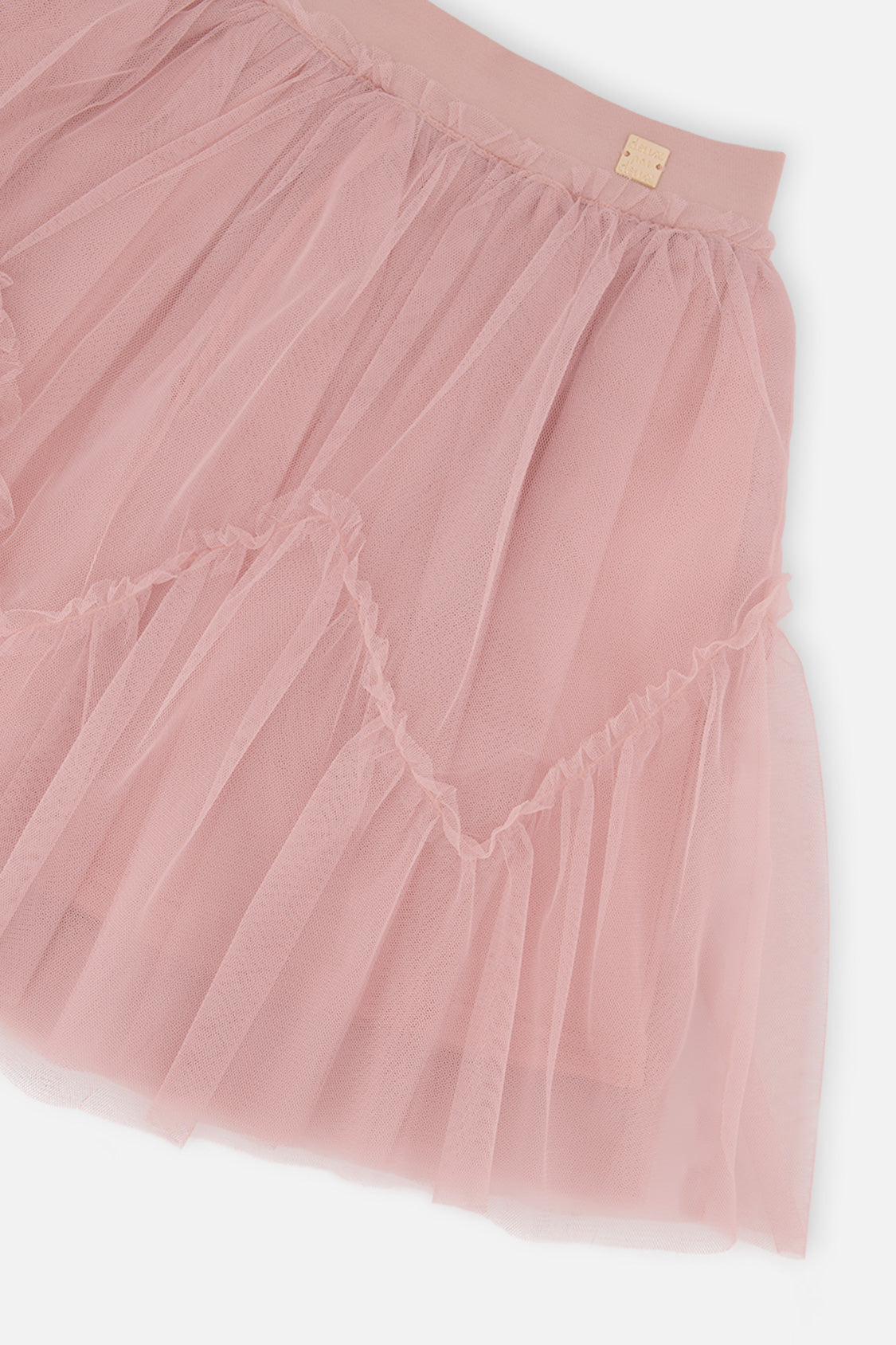 Close-up of the pink mesh tiers and elastic waistband