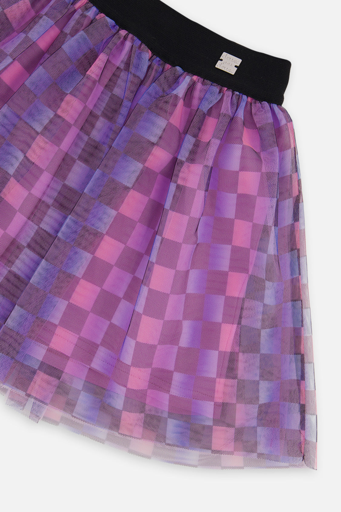 Close-up of the layered checkered mesh and black waistband with logo tab