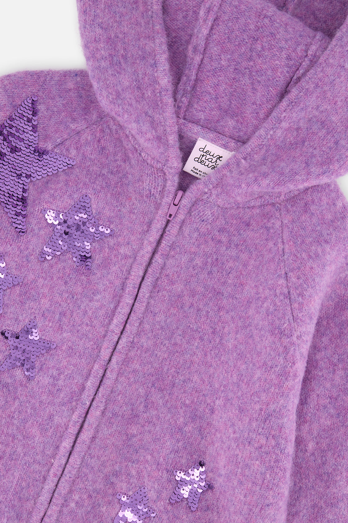 Close-up of the hood, front zipper and sequin stars on the Deux par Deux violet cardigan
