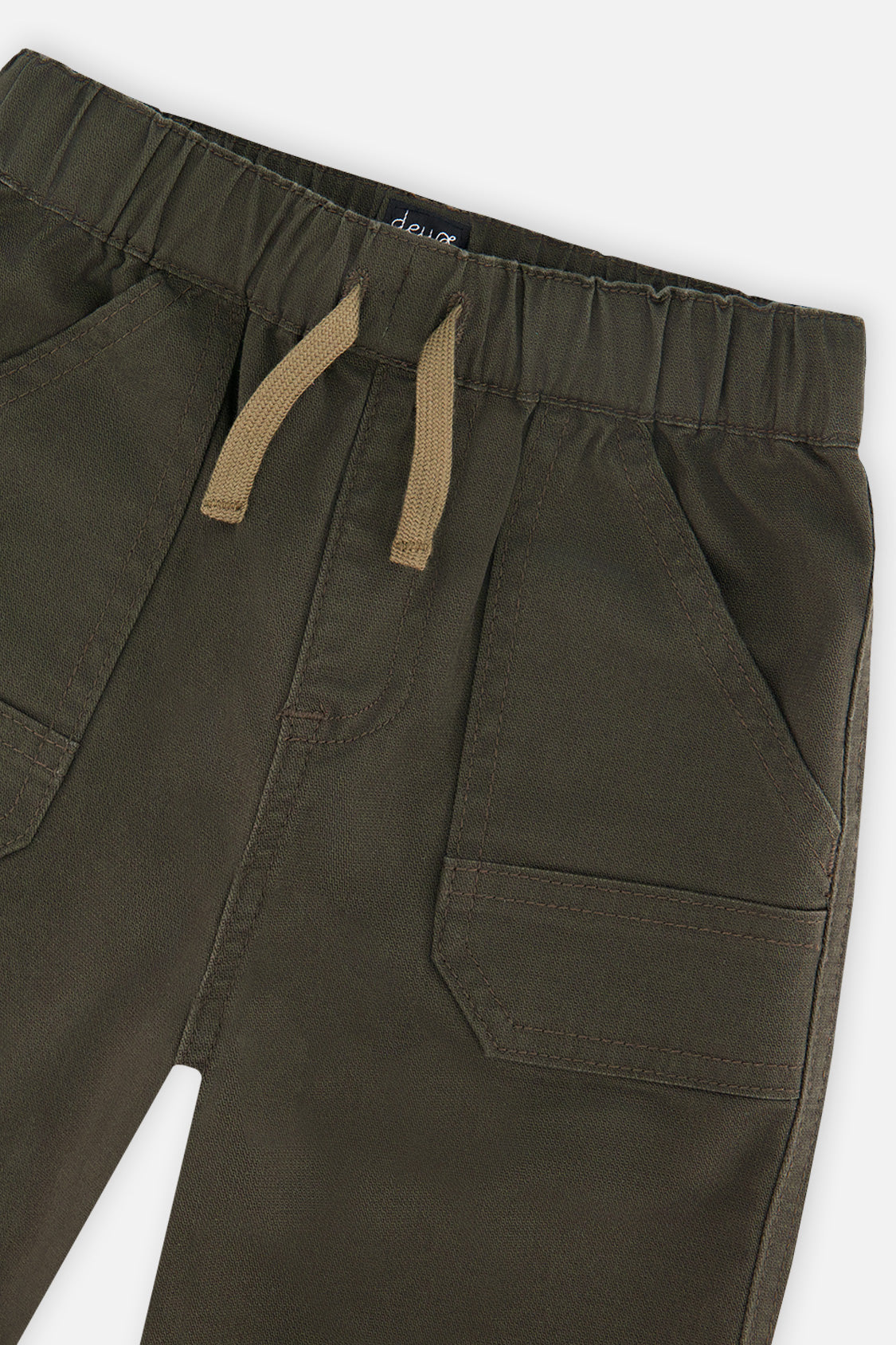 Close-up of the elastic waist, tan drawcord and patch pocket on very dark green stretch canvas jogger pants