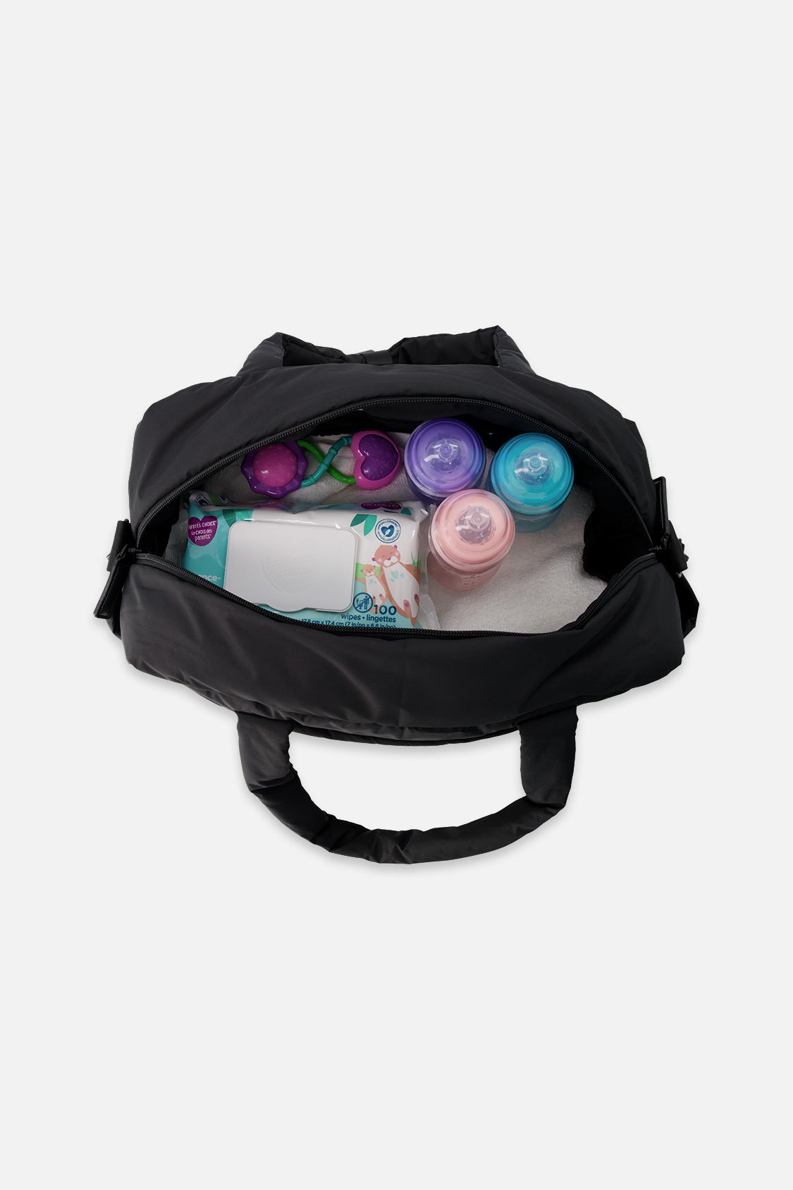 Open black diaper bag showing bottles and baby supplies packed inside