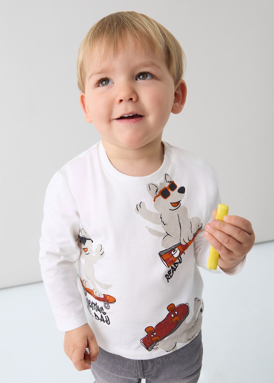 Toddler wearing Ivory animal-print long-sleeve tee, front view, everyday outfit.