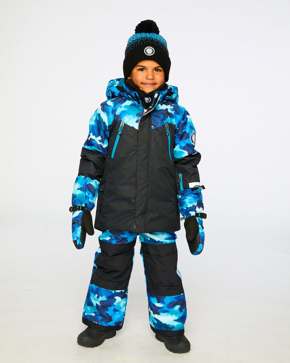 Boys two-piece ski suit — teal/blue camo jacket with black pants, waterproof to -30C.
