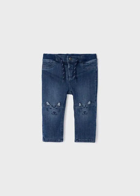 Mayoral baby boy skinny denim pants in blue with cute bear-face knee details and cotton-blend stretch fabric.