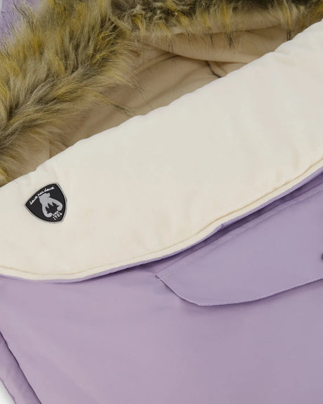 Infant footmuff on stroller during winter walk, draft-blocking hood detail