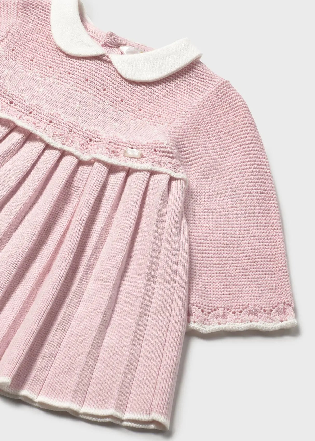 Close-up of jacquard fabric and baby collar on Mayoral dress