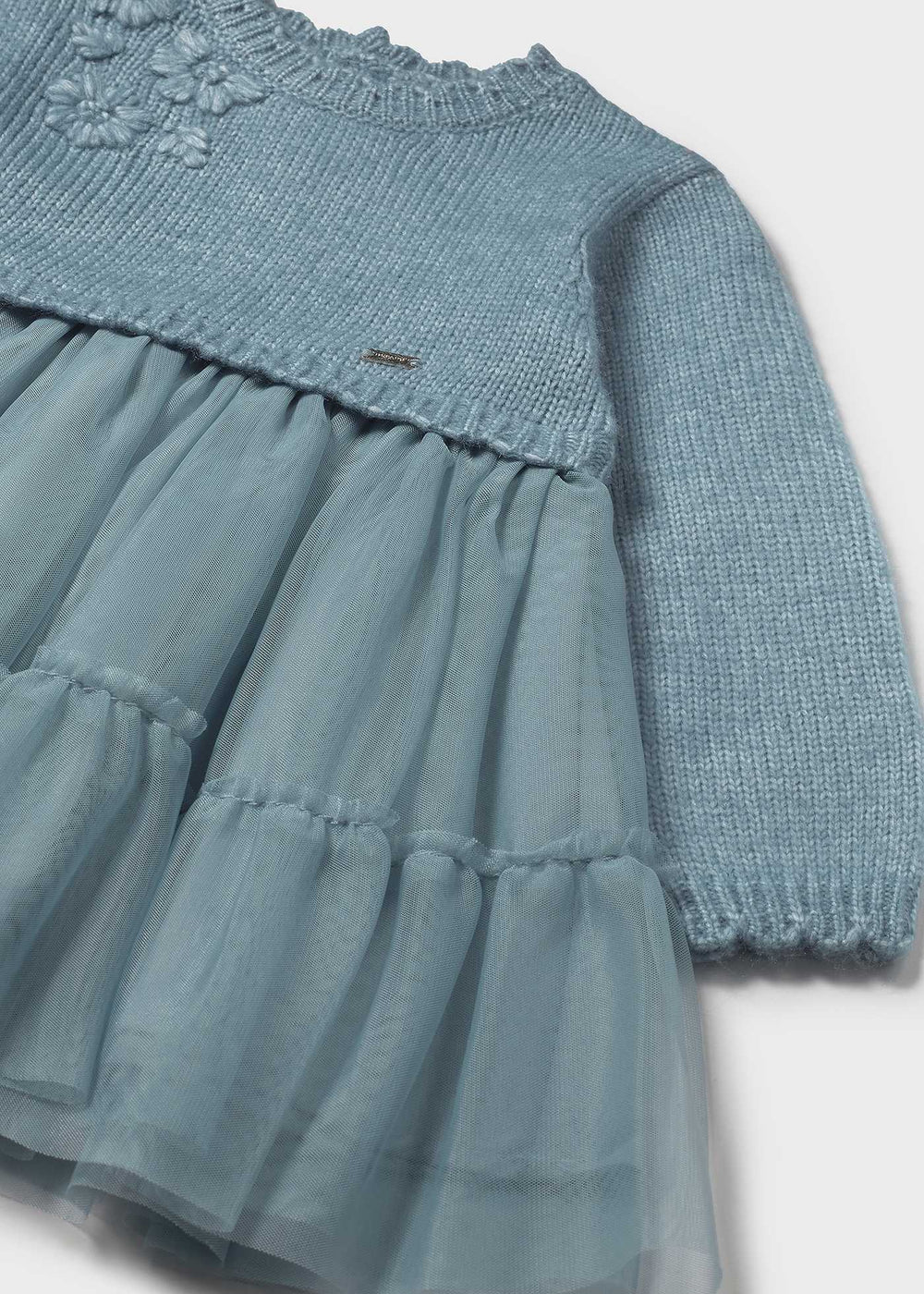 Close-up of knit bodice and airy tulle skirt on Mayoral baby dress