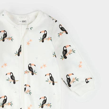 Close-up of ribbed cuffs and toucan print on organic cotton baby sleeper