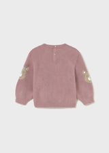 Flat lay back view showing button closure