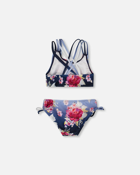 Blue rose two-piece swimsuit laid flat from behind, showing the strappy back and tied hips