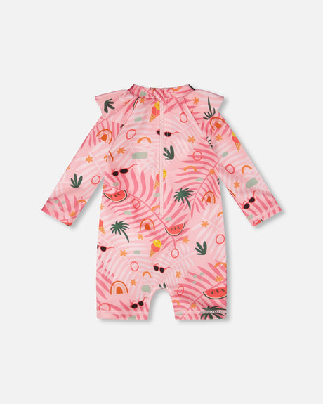 Flat view of the pink beach print rashguard one-piece with long sleeves