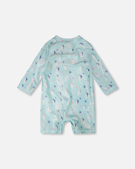 Flat view of the aqua seahorse rashguard one-piece with long sleeves
