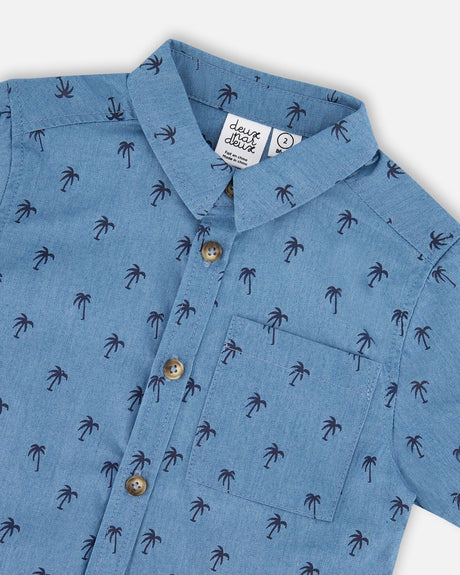 Close-up of the pointed collar, buttons and chest pocket on the palm print chambray