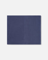 Navy jersey neck gaiter laid flat showing the center seam