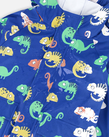 Wet white chameleons turning yellow, orange and red on the blue Deux par Deux rain one-piece