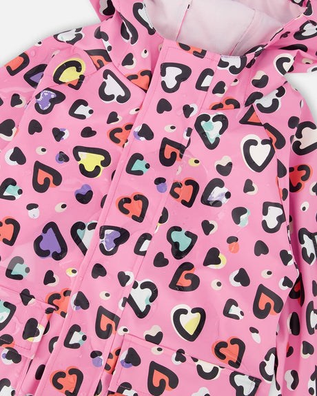 Close-up of the multicolor hearts and front zipper on the pink rain one-piece