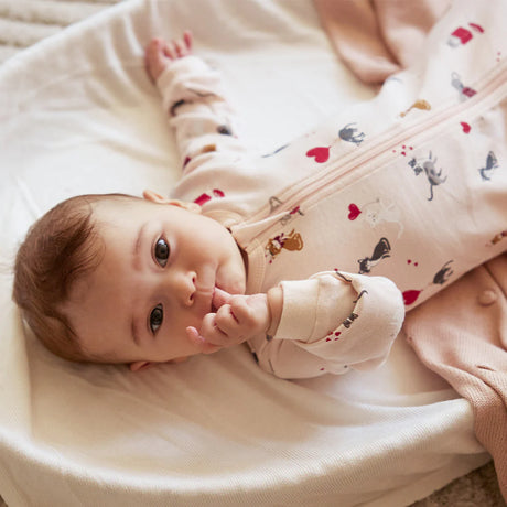 Infant wearing silver peony cat print footed sleeper with two-way zipper Petit Lem