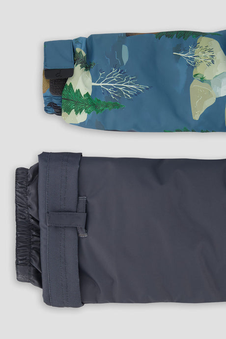 Close-up of the bear print DISCOVER jacket cuff and the adjustable dark grey pant hem
