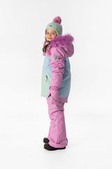 Girl in the pinkish violet colour-block Deux par Deux DISCOVER snowsuit, side view