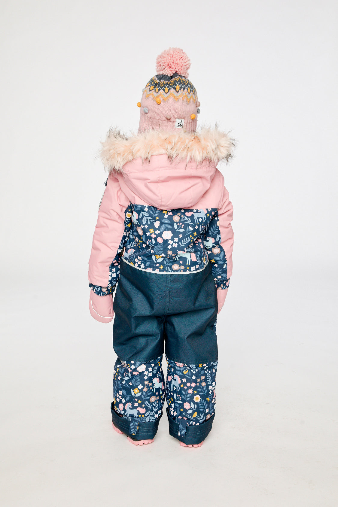 Child wearing the Deux par Deux blue and pink unicorn DISCOVER one-piece snowsuit, lookbook photo 3