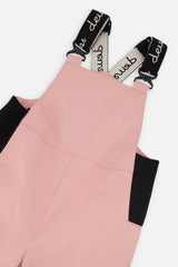 Close-up of the Deux par Deux pink DISCOVER bib and suspenders