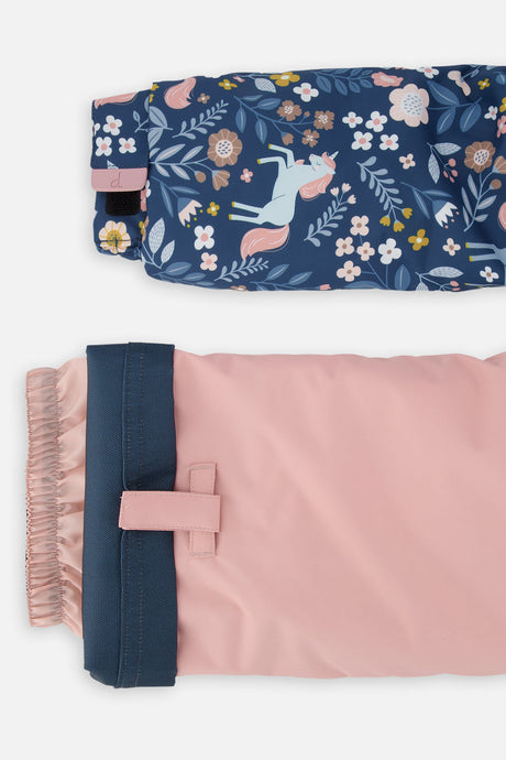 Close-up of the unicorn print DISCOVER jacket cuff and the adjustable pink pant hem