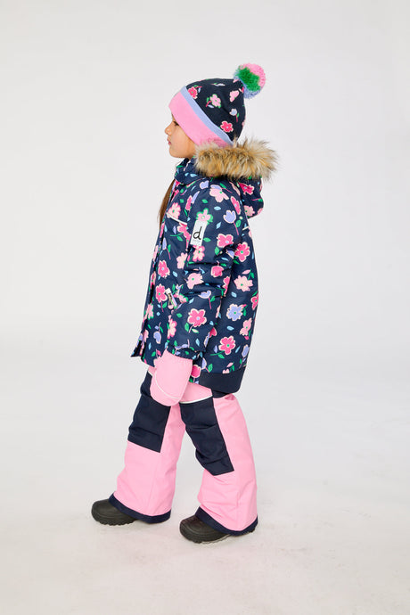 Child wearing the Deux par Deux navy floral DISCOVER snowsuit, side view