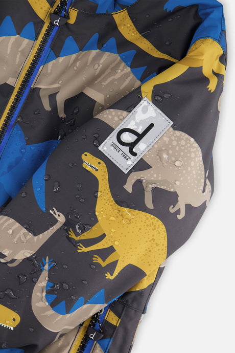 Close-up of the dinosaur-print CHILL jacket sleeve logo patch with water beading