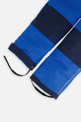 Close-up of the royal blue CHILL snow pant leg with adjustable foot strap
