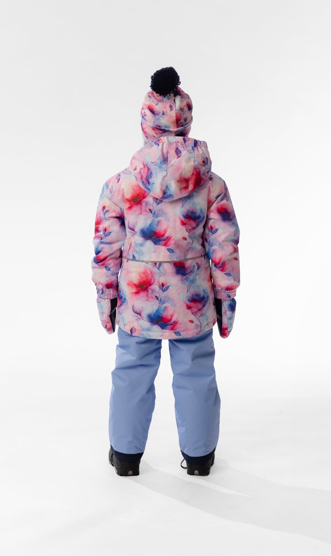 Child wearing the Deux par Deux CHILL snowsuit in Mauve Printed Flowers, lookbook view