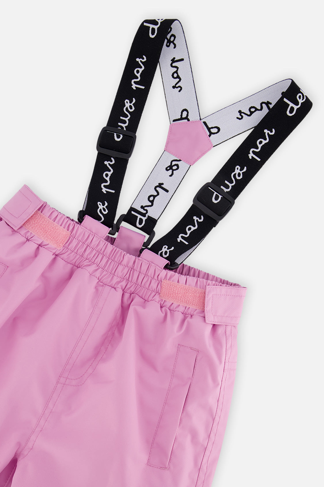 Close-up of the pink CHILL snow pants waist and Deux par Deux logo suspenders
