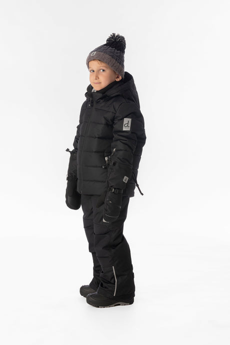 Boy in the all-black Deux par Deux PLAY snowsuit, side view