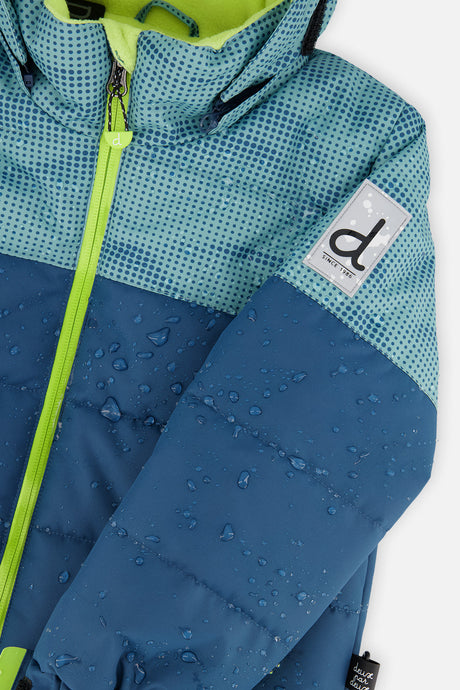 Close-up of the Deux par Deux greyish blue and navy PLAY jacket shell, zipper and logo patch