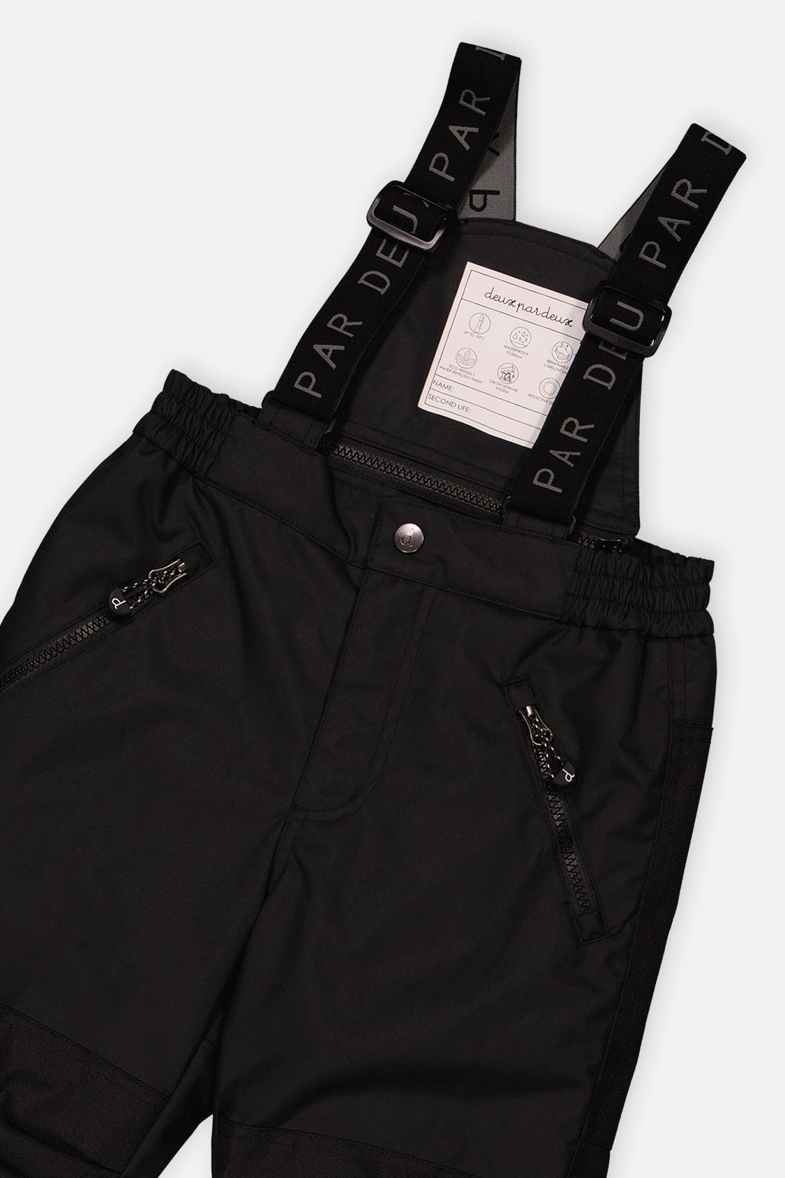 Close-up of the Deux par Deux black PLAY snow pants waist, zippered pockets and suspenders