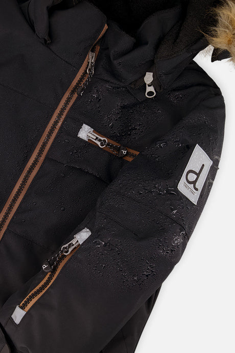 Close-up of the black PLAY jacket front zipper, chest pocket and sleeve logo patch
