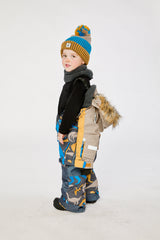 Child wearing the dinosaur PLAY one-piece snowsuit with the top lowered, side view