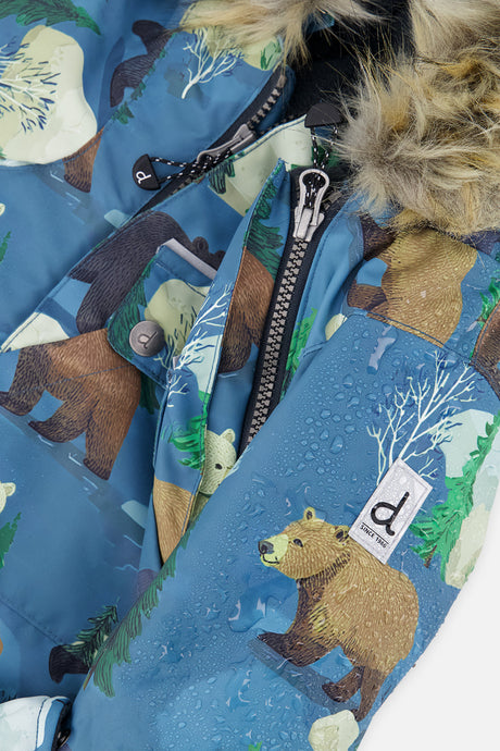Close-up of water beading on the bear print beside the zipper and Deux par Deux logo patch