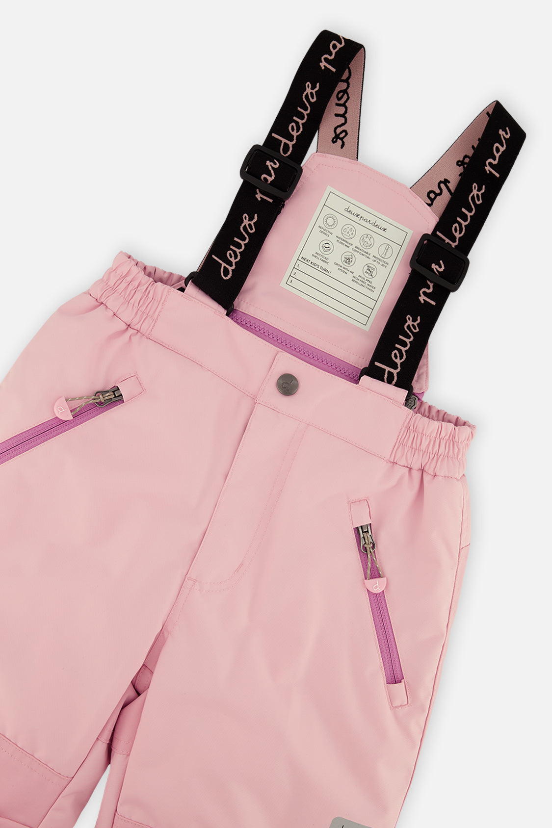 Deux par Deux girls PLAY snowsuit, light pink – close-up of the suspenders and zippered pant pockets