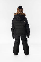 Girl in the black Deux par Deux PLAY snowsuit with leopard faux-fur trim, back view