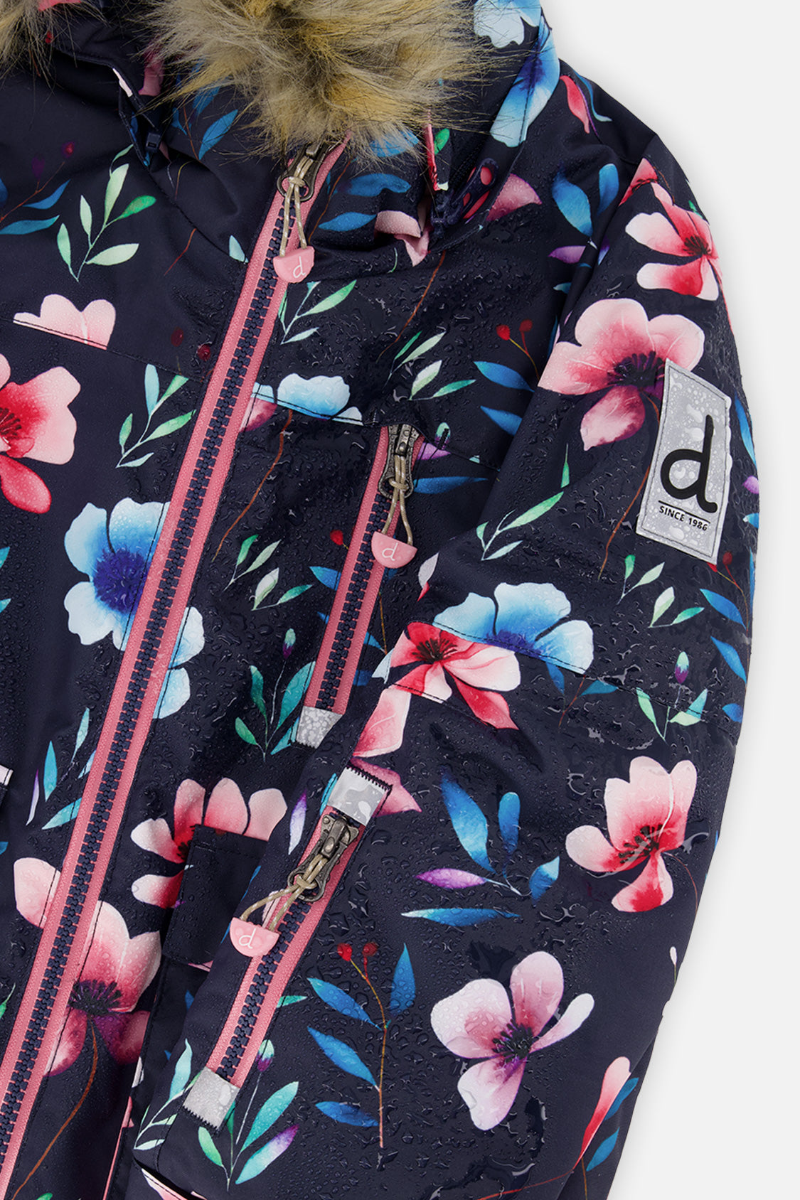 Close-up of the pink and blue floral print and faux-fur hood trim