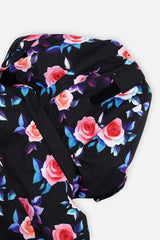 Deux par Deux girls' PLAY two-piece snowsuit in black rose print, further studio view