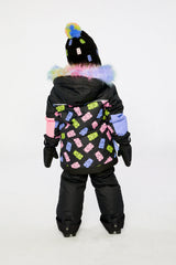 Back view of a child wearing the black gummy bear print PLAY snowsuit