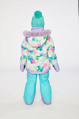 Child in the PLAY snowsuit with diamond-print jacket and turquoise and purple pants, third lookbook shot
